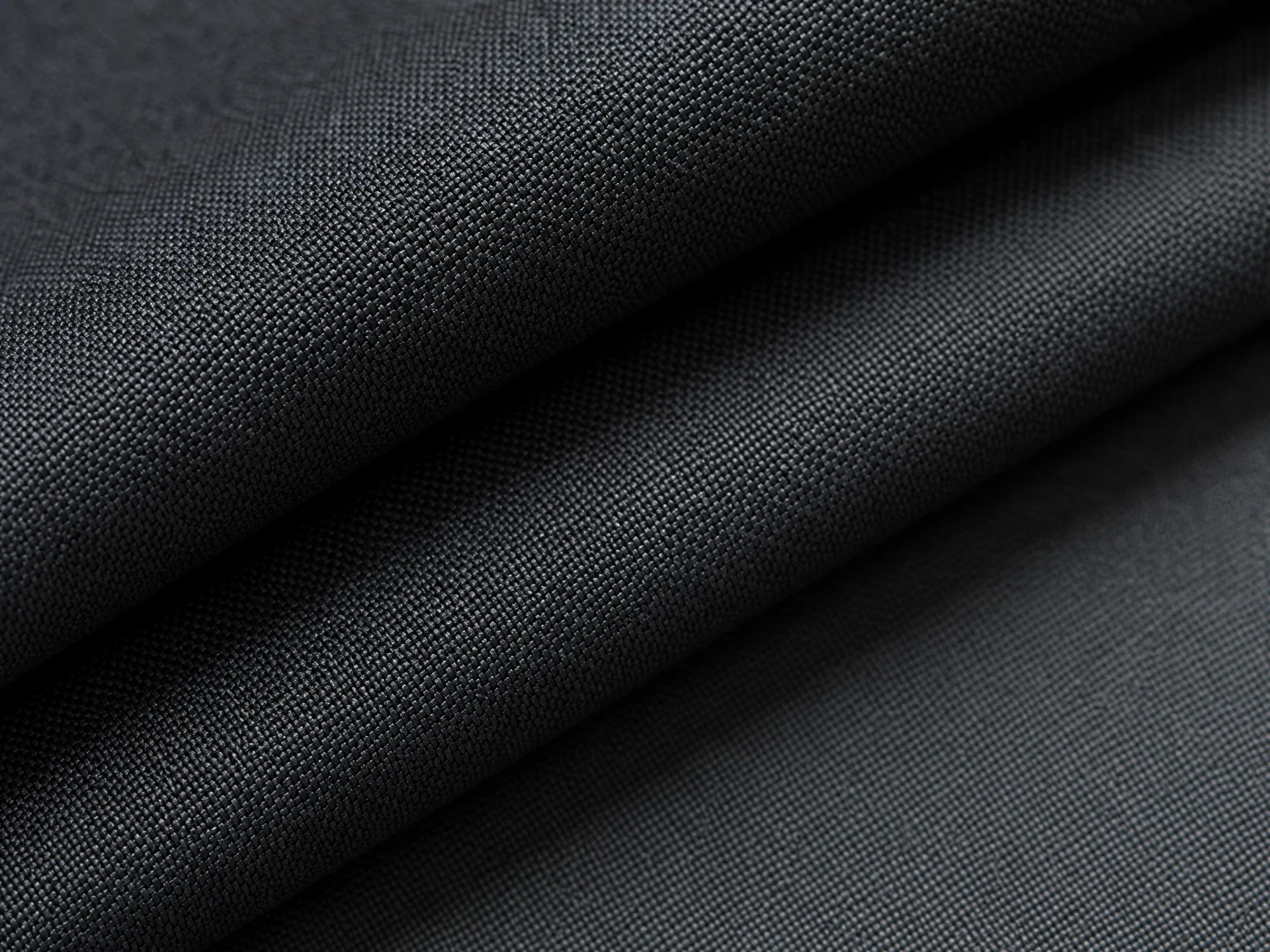 Charcoal technical woven fabric detail for apparel material reference